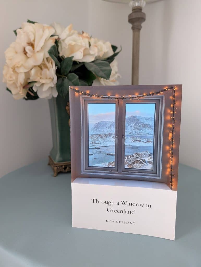 Through a Window in Greenland - Book cover on table